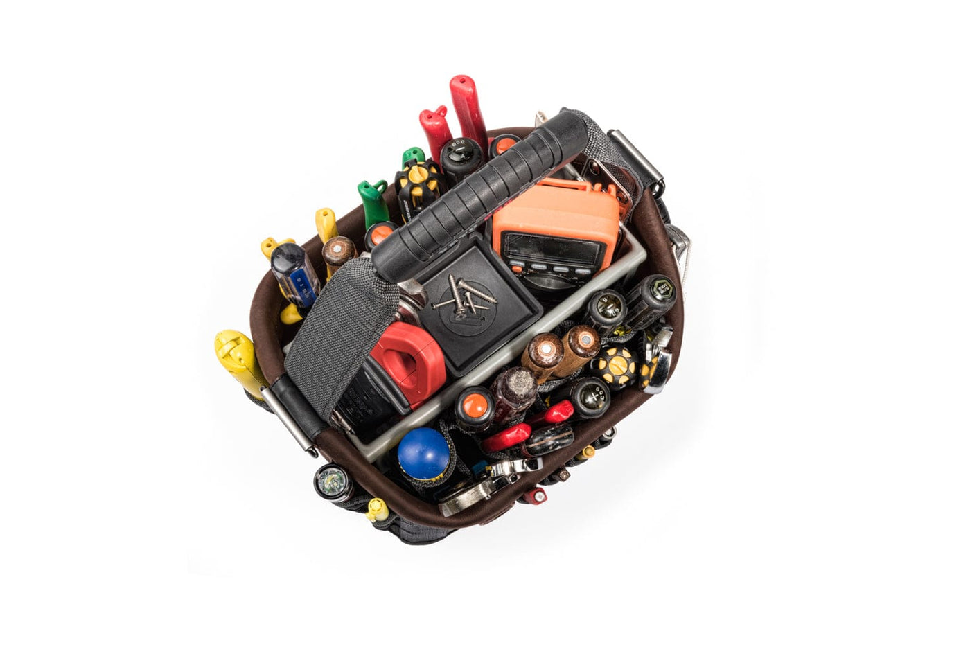 A top-view of the Veto Pro Pac Tech OT-MC Open Tool Bag showcases customizable storage with vertical pockets filled with tools like a flashlight, batteries, pliers, and a multimeter, all set against a white background.