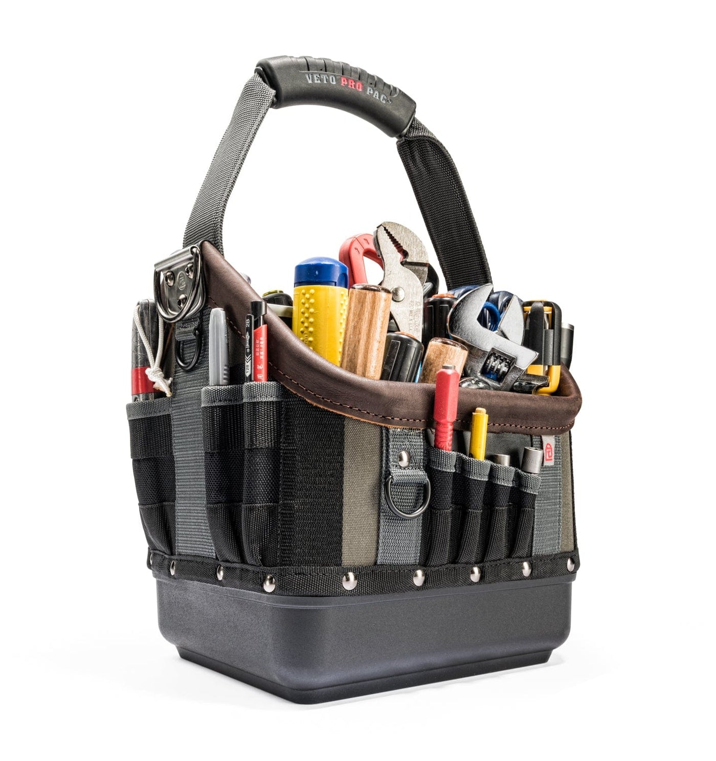 The Veto Pro Pac Tech OT-MC Open Tool Bag, by VET, is a black and gray bag with vertical pockets, holding tools like pliers, screwdrivers, and a tape measure. With its sturdy handle, it stands upright for customizable storage and organized project solutions.