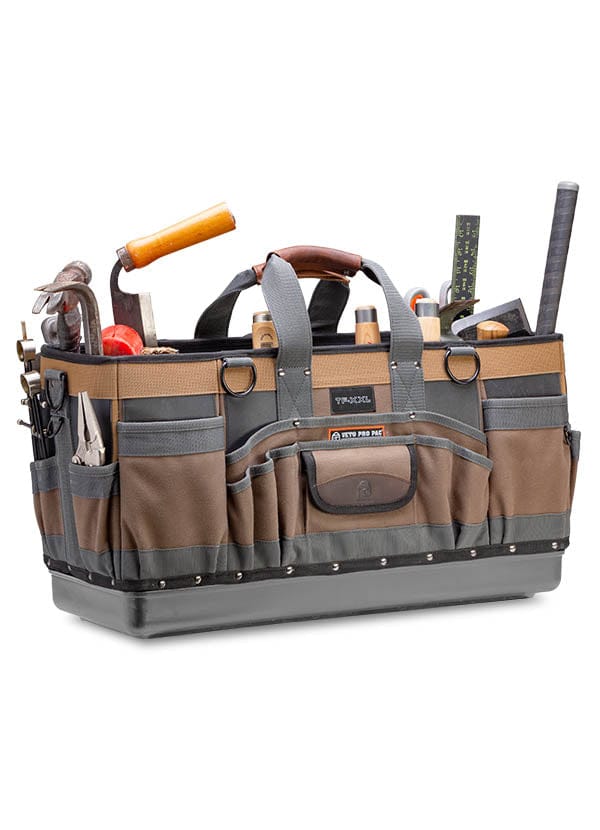 A VET Veto Pro Pac Timber Framer Tool Bag, in brown and gray, contains various tools like hammers, a saw, a tape measure, and screwdrivers.