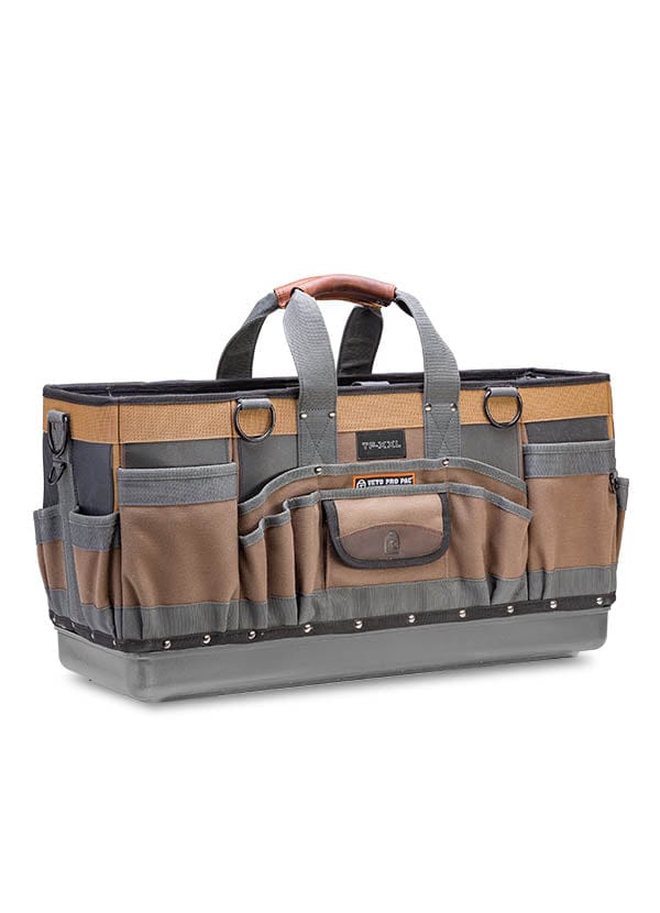 The Veto Pro Pac Timber Framer Tool Bag by VET is a spacious brown and gray bag with multiple pockets and two handles, perfect for efficient tool storage and organization during timber framing projects.