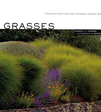 Book cover titled "Grasses" by Workman-Storey, featuring a garden landscape with various ornamental grasses and garden flowers, highlighting their use in erosion control. Text includes the author Nancy J. Ondra and photographer Saxon Holt.
